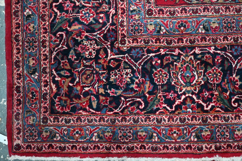 A fine old Persian hand-made Kashan carpet, the red ground with repeating linked garden vine design, - Image 4 of 12