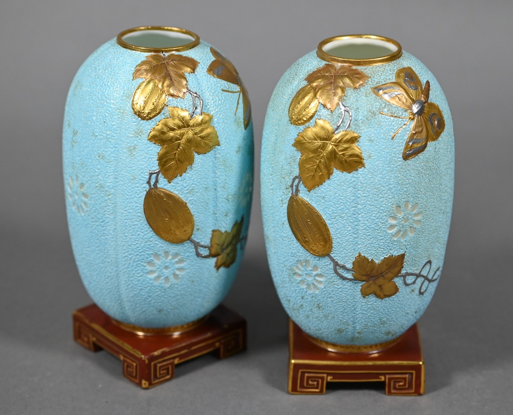 Pair of Victorian Minton china vases or night-lights in the Aesthetic manner, modelled on pale