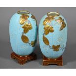 Pair of Victorian Minton china vases or night-lights in the Aesthetic manner, modelled on pale