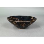 A Chinese Southern Song style Jizhou stoneware bowl, the interior with three paper-cut phoenix