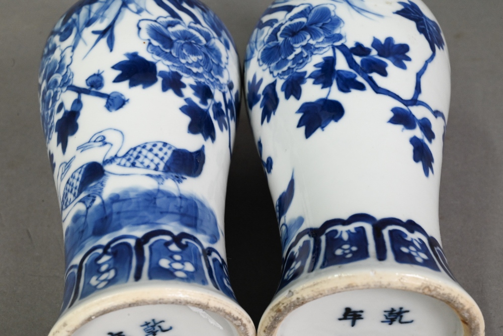 A pair of late 19th century Chinese blue and white baluster vases, late Qing dynasty, painted with - Image 17 of 17