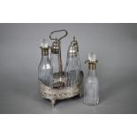 George III oval silver cruet with wooden platform, engraved and pierced sides and scroll feet,