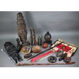 Quantity of tribal artefacts of mixed ethnography, including headhunters sword, bead work, carved