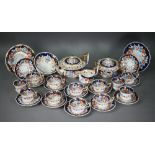 A Regency china part tea service, painted and gilded with floral and foliate decoration,