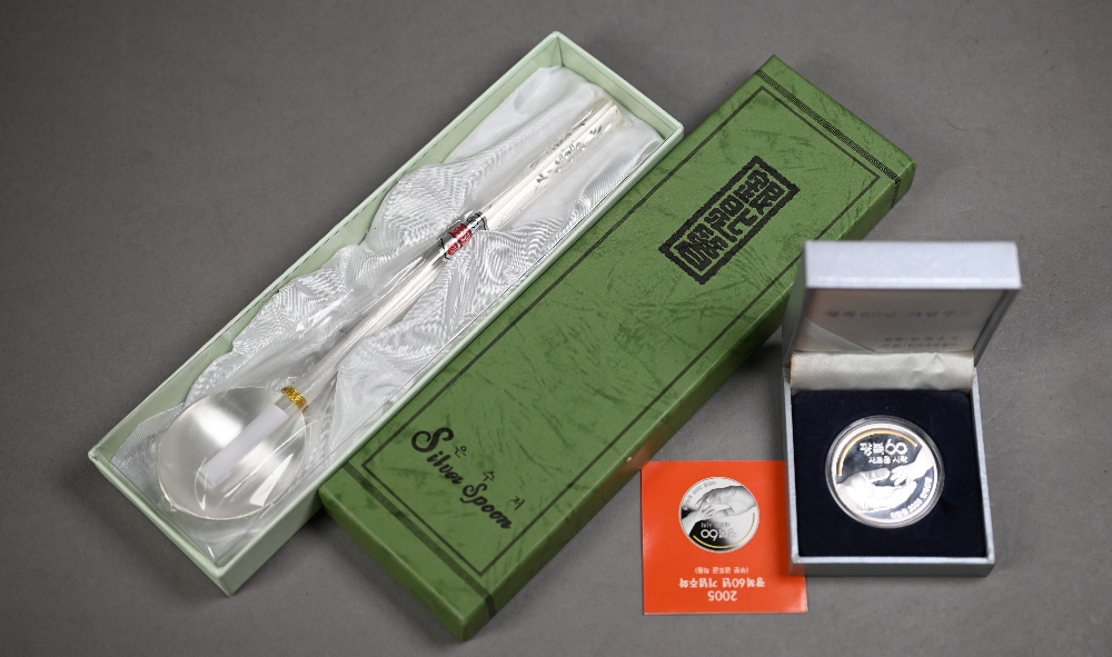 Boxed fine silver (.999 grade) spoon and chopsticks set (unused) to/w a 2005 Korean 20000 WON silver