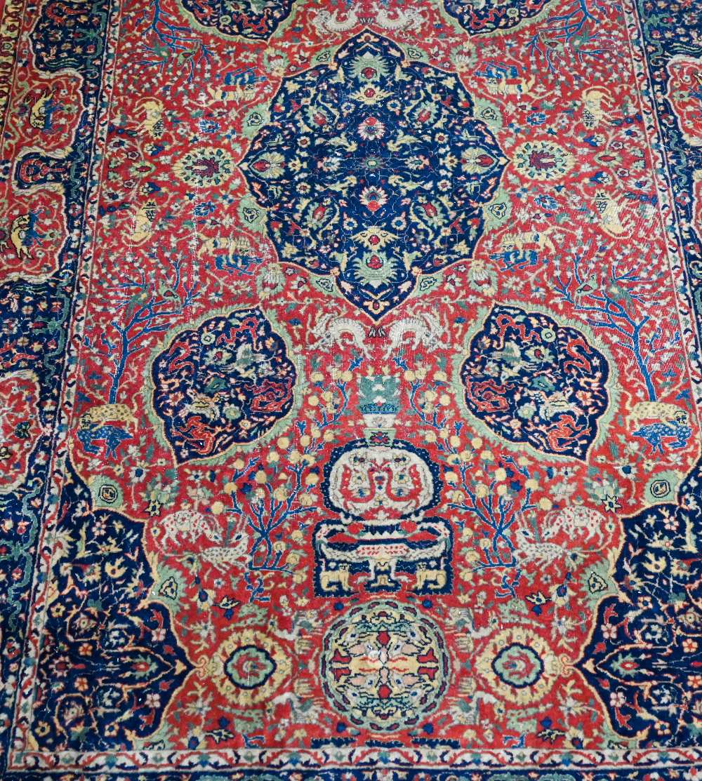 A good fine antique Persian Kashan rug, the rust-red ground centred by a blue ground medallion, - Image 2 of 3