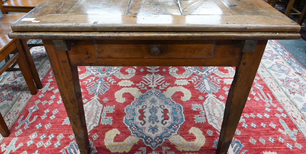 An antique French fruitwood extending draw leaf dining table, with frieze drawer to one end, - Image 2 of 15