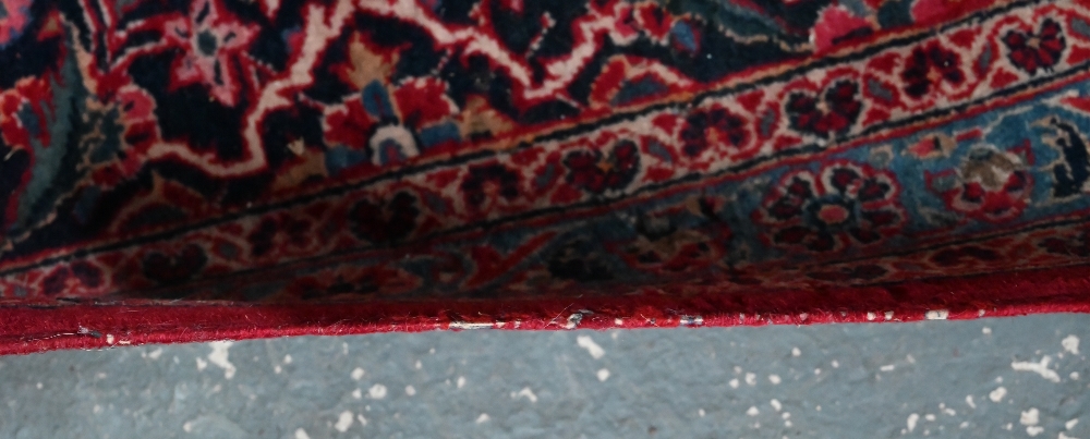 A fine old Persian hand-made Kashan carpet, the red ground with repeating linked garden vine design, - Image 9 of 12