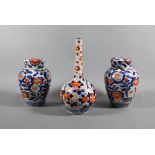 A pair of 19th century Japanese Imari ovoid caddy's with insert covers and domed outer covers,