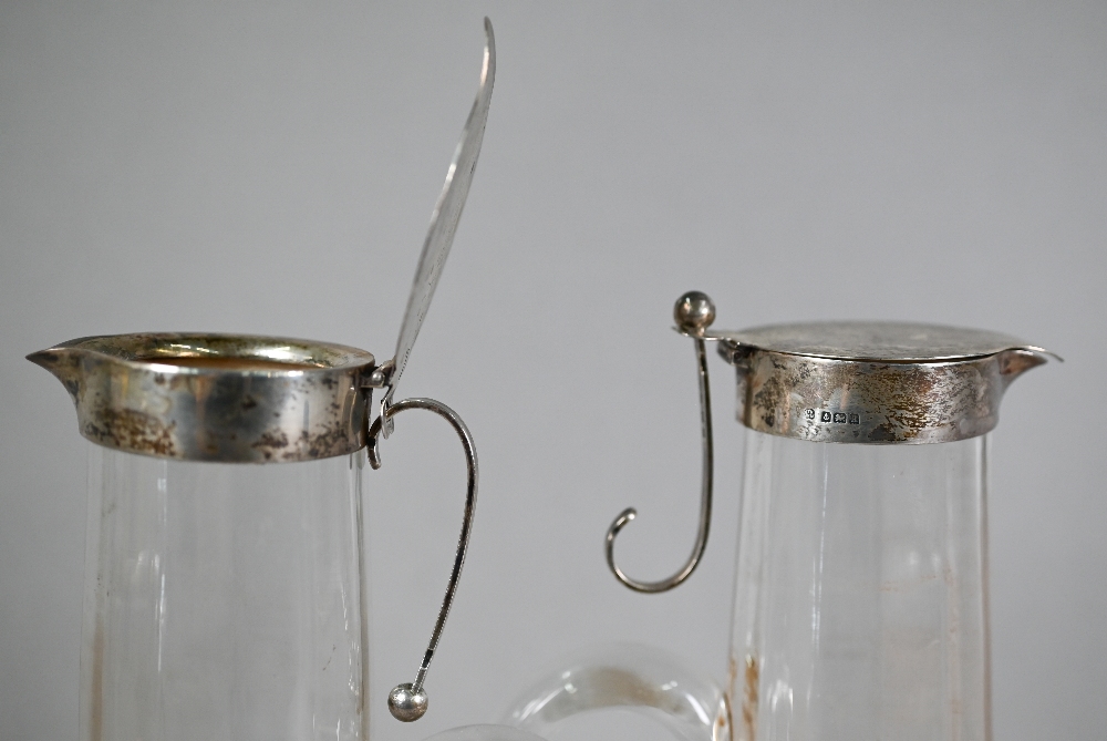 Pair of Edwardian cut glass claret jugs with flared bases and silver collars and covers with - Image 3 of 5