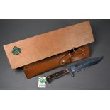 Puma Bowie knife with 20 cm blade and two piece antler handle, in leather scabbard and pine