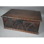 A 17th century English oak bible box, lunette carved to front and sides, with iron lock-plate, 65 cm