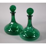 Pair of Victorian green glass ship's decanters, the flattened stoppers, engraved for Brandy and