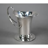 Edwardian Art Nouveau silver cream jug with organic whiplash handle and flared spout and foot-rim,