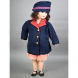 A 1920s composite girl-doll, dressed in tailored Naval jacket. 59 cm