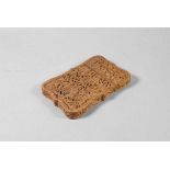 A 19th century Chinese Canton sandalwood card case profusely carved with a village scene,