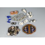 A cloisonné enamel buckle, twenty-three flower decorated buttons, dress-clips, cufflinks etc
