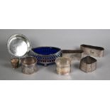Three silver napkin rings and a pin dish, a pair of napkin rings engraved with animals and
