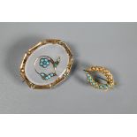 A Victorian oval brooch in white chalcedony with turquoise seed pearl floral decoration and yellow