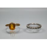 An 18ct white gold half eternity ring set with ten small diamonds, size L, to/w a citrine-set ring