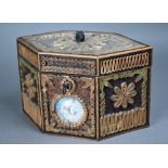 A George III tea caddy decorated with gilded rolled paper and crystal shards, and inset with two