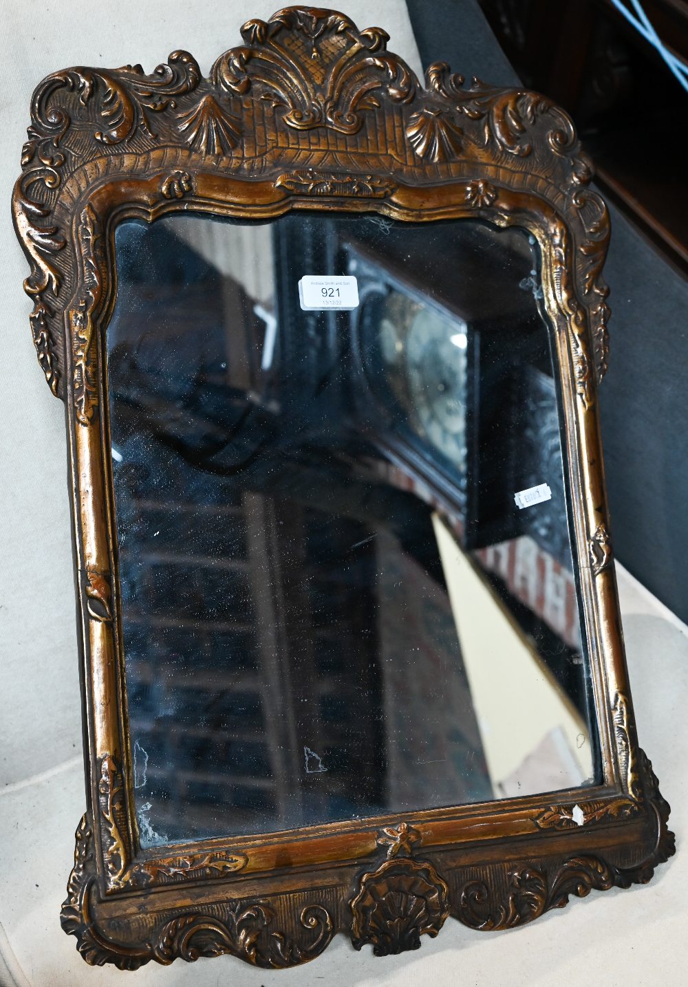 An antique giltwood and gesso mirror, 62 cm x 40 cm