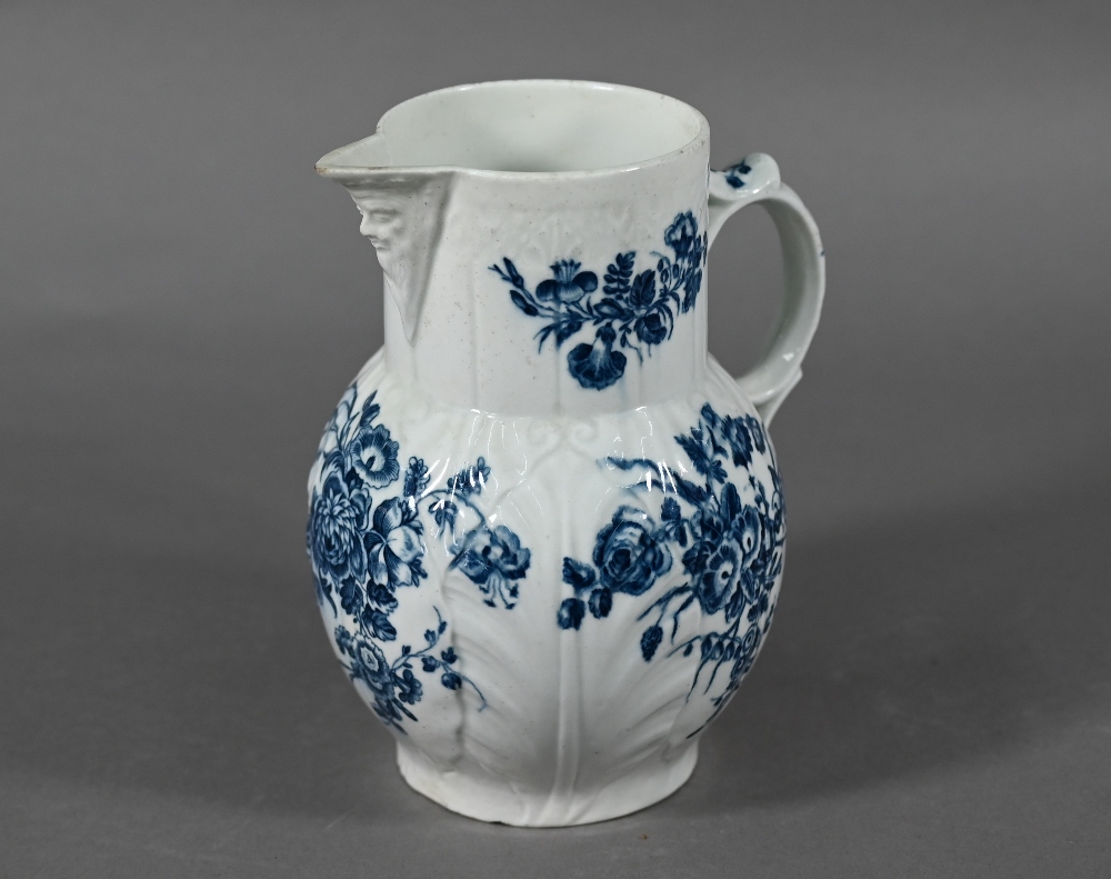 First Period Worcester cabbage-leaf jug with Bacchus-mask spout and scroll handle, printed with blue