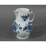 First Period Worcester cabbage-leaf jug with Bacchus-mask spout and scroll handle, printed with blue