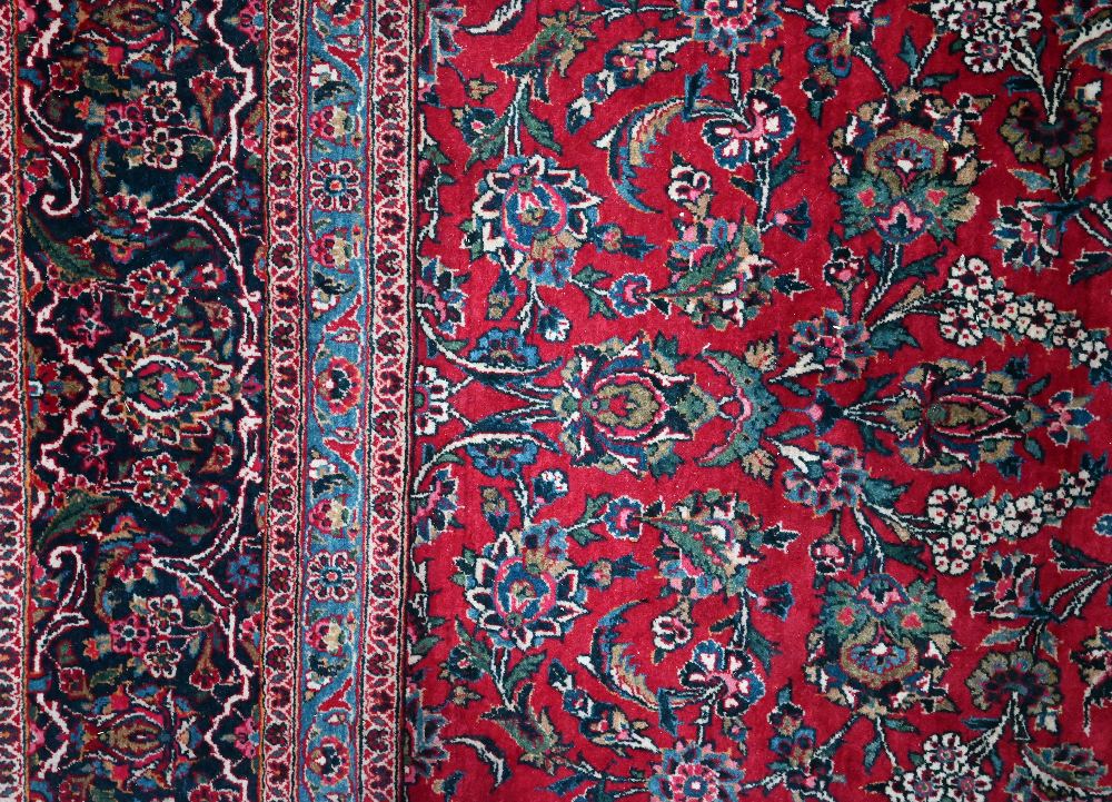 A fine old Persian hand-made Kashan carpet, the red ground with repeating linked garden vine design, - Image 12 of 12