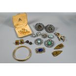 A collection of vintage and later brooches including Arts & Crafts, paste set buckles, dress