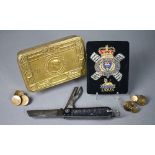 A WWI Queen Mary Christmas tin to/w a Cameron Highlanders officers swagger stick, cap badge and