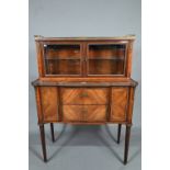 A fine French gilt-metal mounted kingwood salon cabinet, the marble top with 3/4 pierced gallery