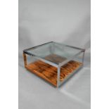 A mid-century chrome and rosewood glass top coffee table designed by Richard Young for Merrow
