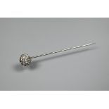 A white metal stick pin set with six white spinel as a cluster, 5.5 cm long