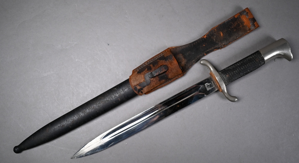 A German Fire/Police dagger with 24 cm fullered Eickhorn blade and two piece hatched grip, in