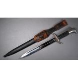 A German Fire/Police dagger with 24 cm fullered Eickhorn blade and two piece hatched grip, in