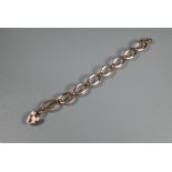 A 9ct rose gold bracelet formed of elongated open links, with padlock attached, 12.8g