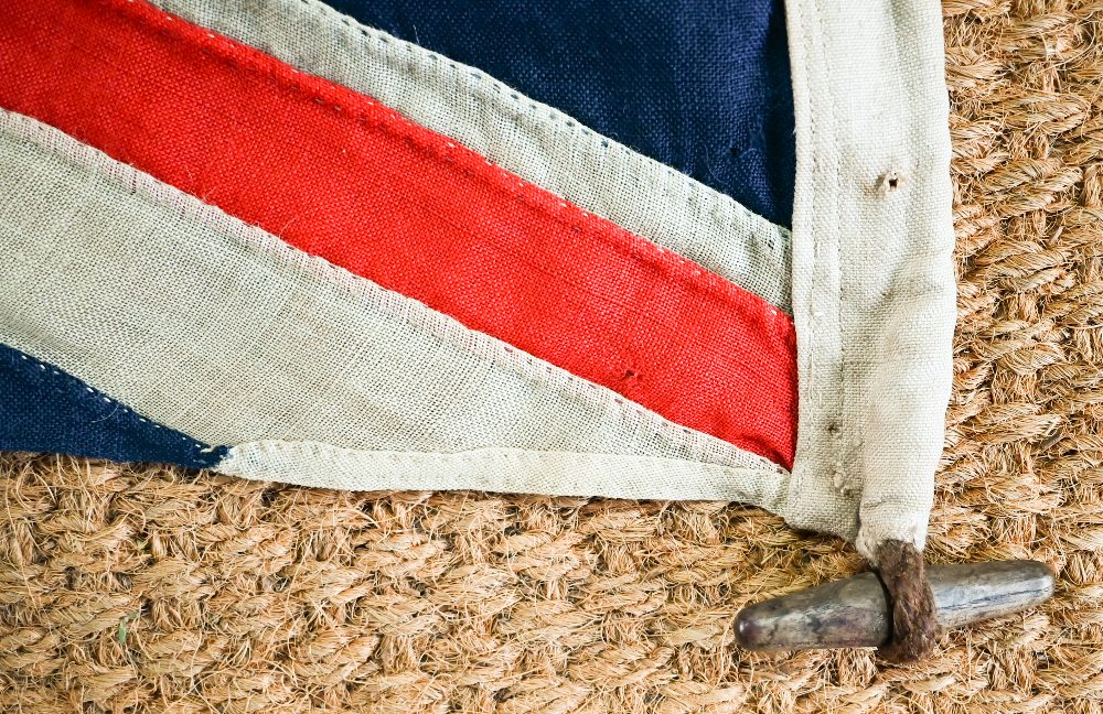 A WWII period Royal Navy ensign, of stitched panels with 'union jack' to top corner, stencilled 'C - Image 3 of 5