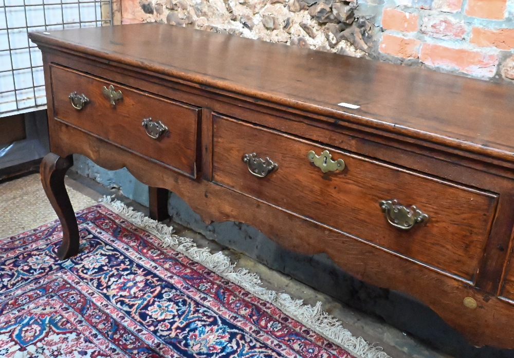 An 18th century cross-banded oak low dresser, with three cock-beaded frieze drawers over a wavy - Image 3 of 5