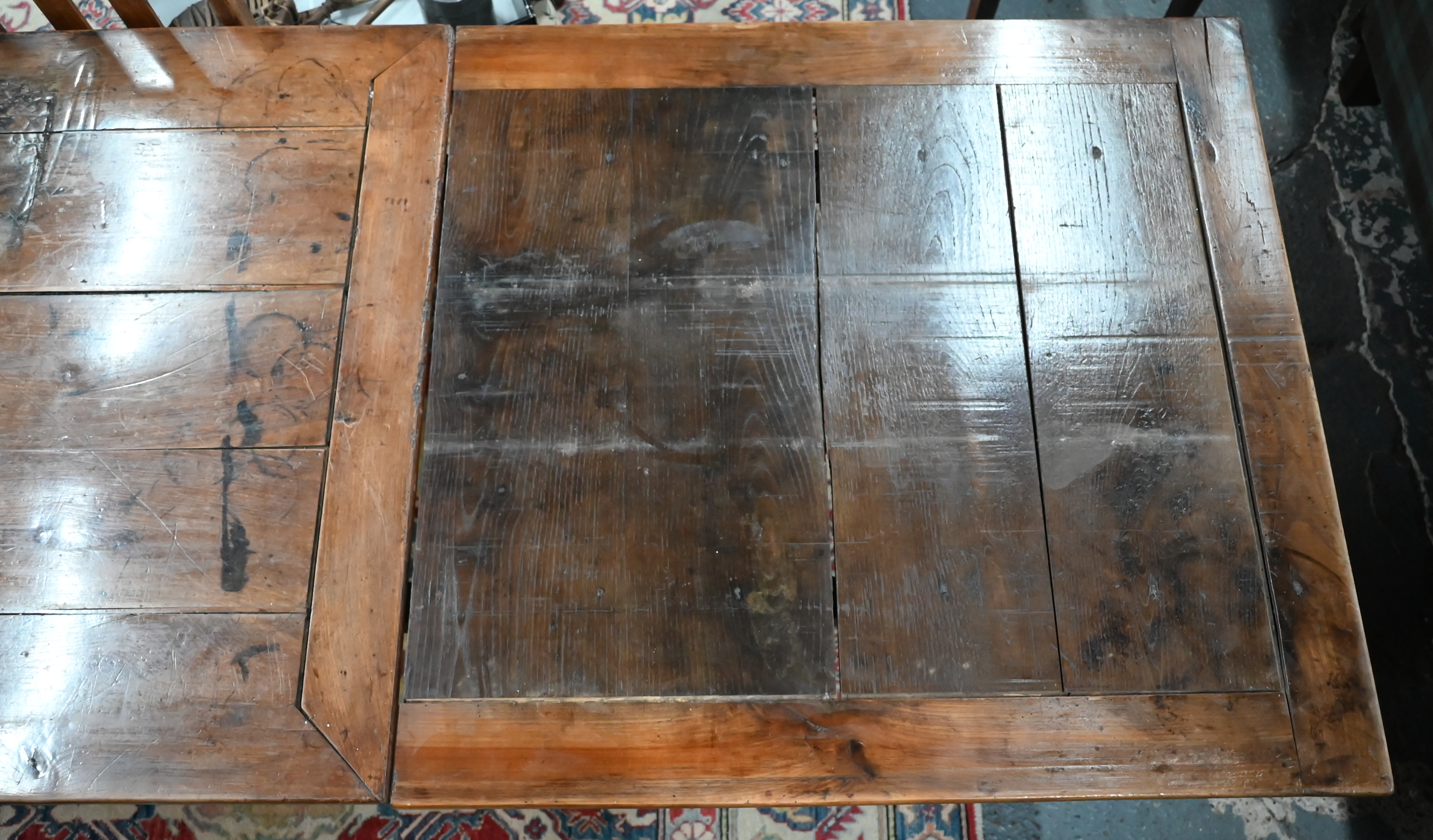 An antique French fruitwood extending draw leaf dining table, with frieze drawer to one end, - Image 13 of 15