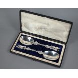 Pair of good quality Victorian silver serving spoons with oval bowls and ornate stems, cast and
