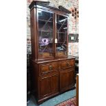 A George III mahogany secretaire / bookcase, the (associated) astragal glazed upper part enclosing