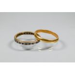 An 18ct yellow gold wedding band, size N, 1.9g to/w another yellow and white metal band (2)