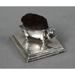 Edwardian silver novelty 'pig' pen-wipe, it's back mounted with bristles, on rectangular base,