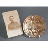 A WWI bronze Death plaque (polished) and portrait photo for 2nd Lieutenant Douglas George Rouquette,