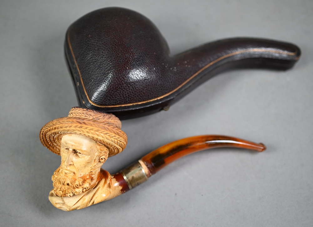 Edwardian Meerschaum pipe, carved as a bearded gentleman in a straw hat, on silver-mounted amber