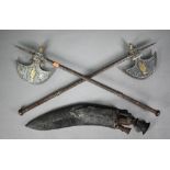 Pair of antique Indian steel axes with brass-mounted crescent blades and daggers concealed in the