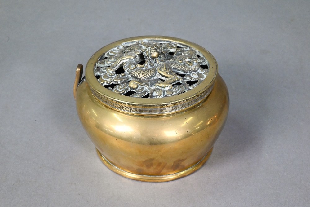 A Chinese circular brass travelling handwarmer/brazier with reticulated dragon cast cover 13 cm - Image 5 of 10