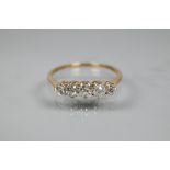 A graduated five stone diamond ring, the old cut diamonds in scroll claw mount, 9ct yellow gold set,