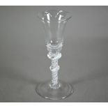 A Georgian cordial glass with flared rim on double-knop stem with double opaque twist and domed